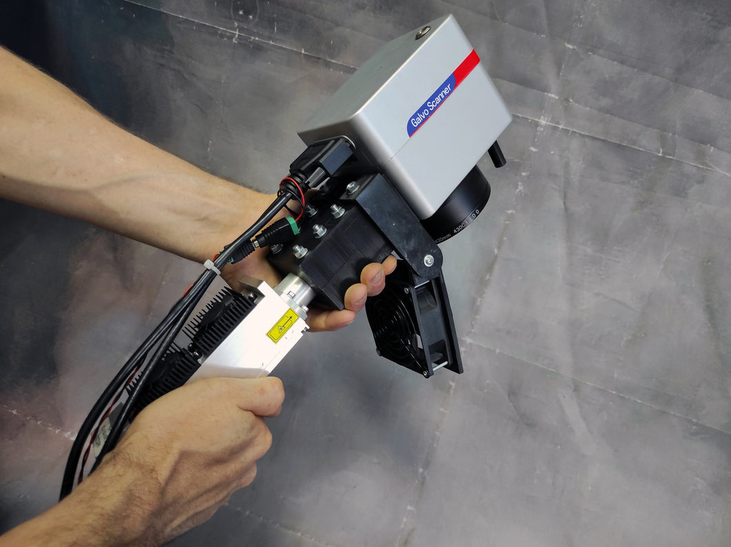 Hand-held laser rust removal instrument